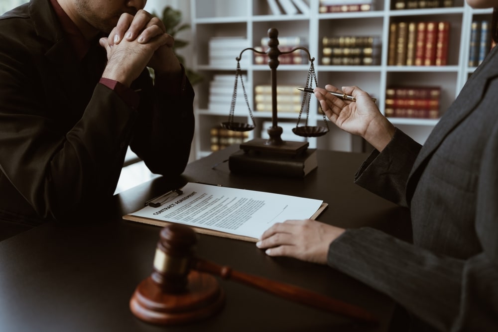 Filing Bankruptcy Client Going Over Bankruptcy Papers With His Attorney